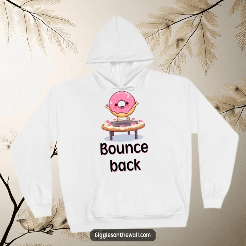 Funny donut character mid-bounce on a frosting trampoline, featured on a warm hoodie, offering comfort and playful, sugary energy.