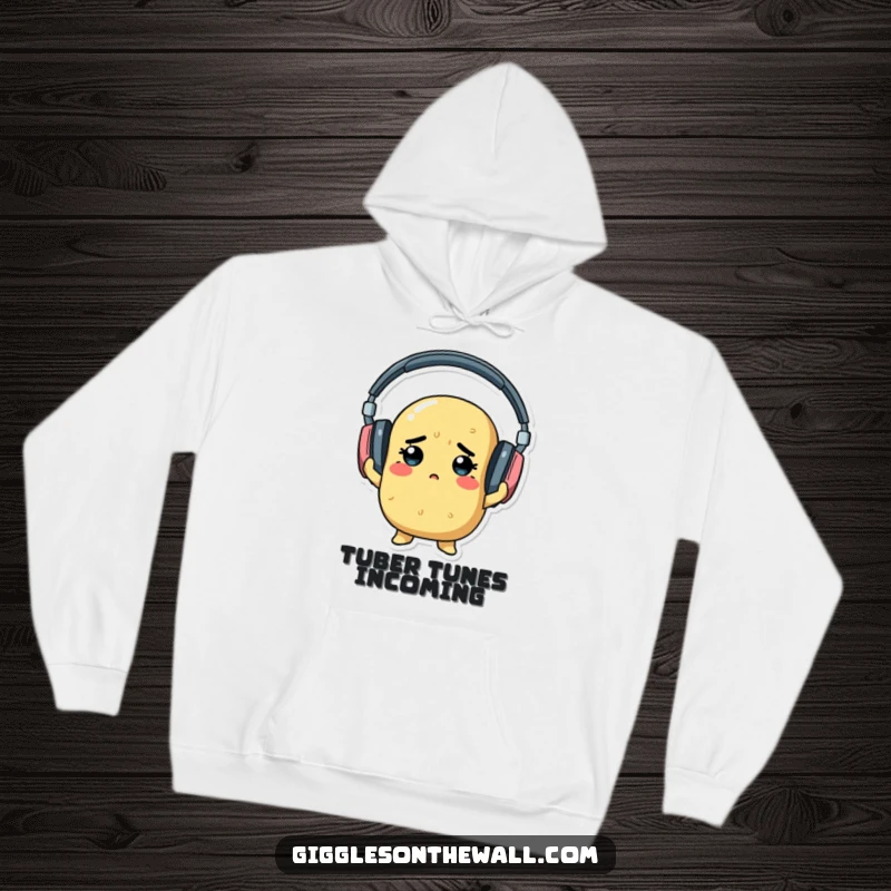 A determined potato hilariously trying to put on giant headphones, illustrated on a warm and humorous hoodie.