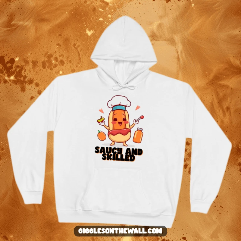 Funny hoodie with a smiling hot dog chef character in a tiny hat, skillfully juggling condiments, ready for action.