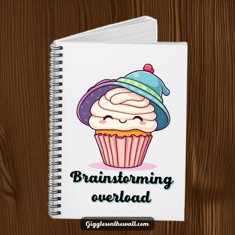 Funny notebook with a playful cupcake trying to wear two hats, perfect for capturing ambitious ideas with humor, a unique funny gift.