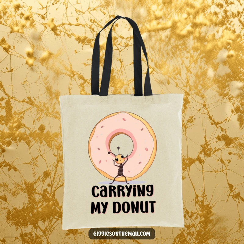 Funny tiny ant character lifting a giant donut on a tote bag, a symbol of determination.