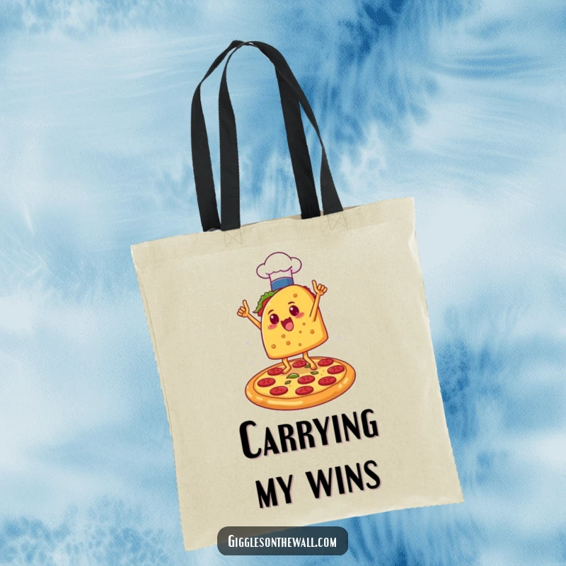 Funny Taco Chef Victory Tote Bag: A tote bag showing a taco in a chef hat doing a victory dance on a pizza, ideal for humorous shopping.